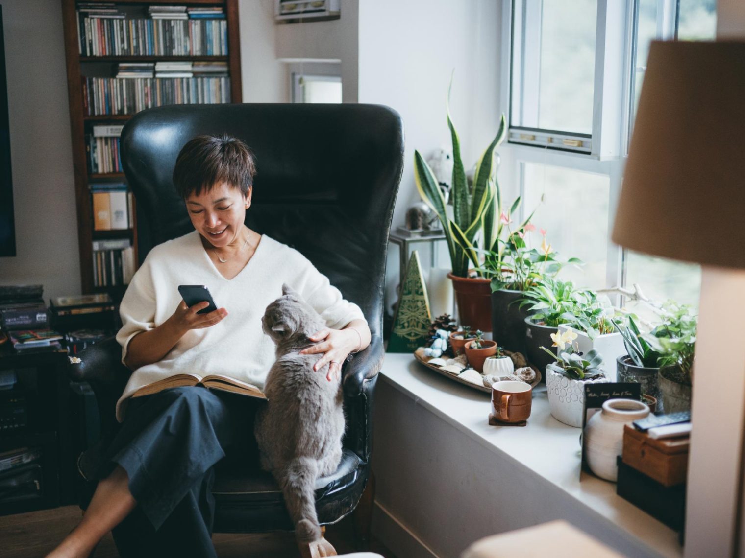 A single woman with her cat in her new home.