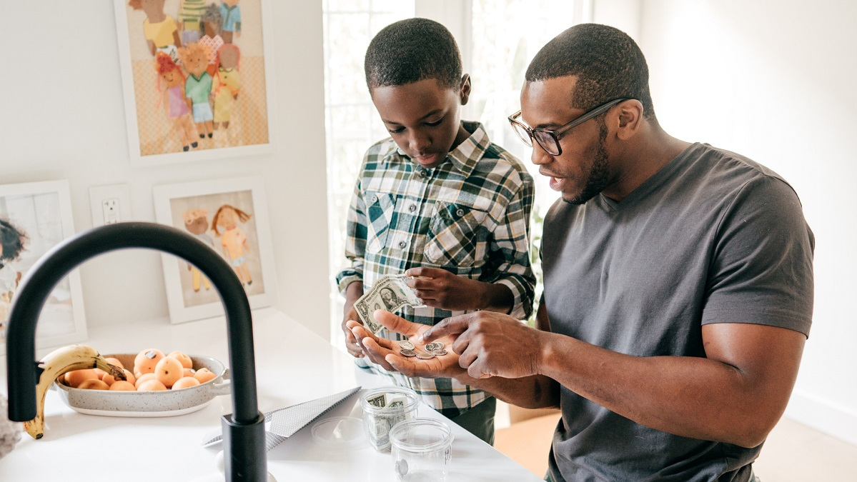 Father and son discuss saving money.