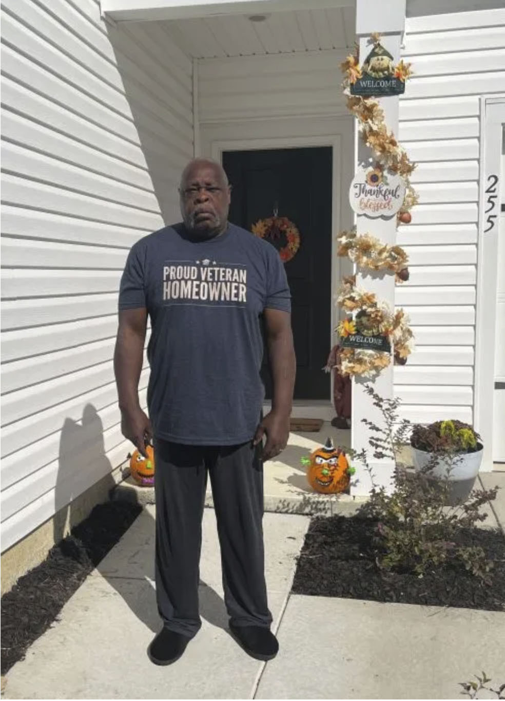 picture of Lester B. in front of a house