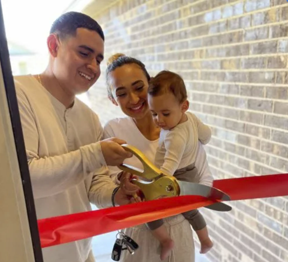 picture of Jylene M. in front of a house
